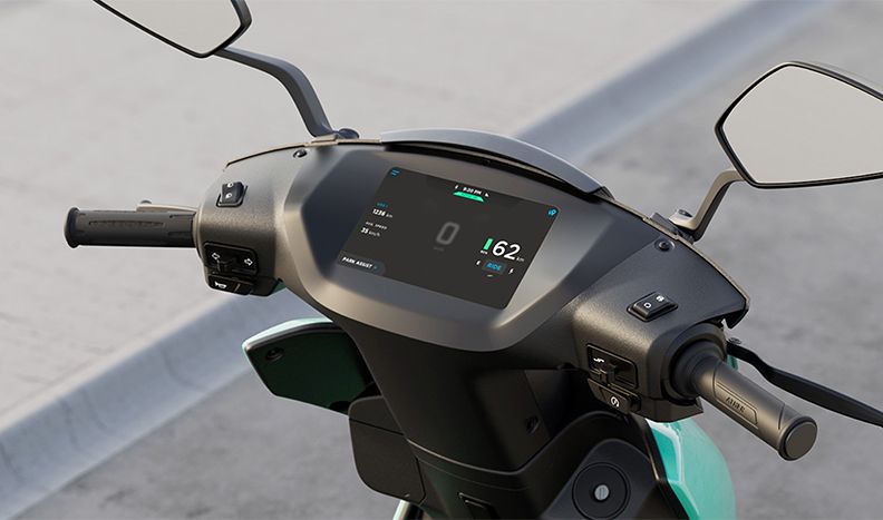 Close-up of the Ather 450x scooter handle bars and dashboard touchscreen.