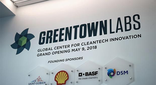 Sign reading “Greentown Labs. Global Center for Cleantech Innovation. Grand Opening May 9, 2018.” Plaques for founding sponsors under sign.